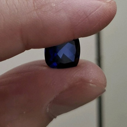 Artificial sapphire like new, dark blue, approx. 1cm x 1cm