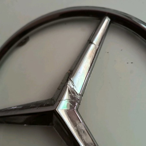 Plastic Mercedes emblem used from truck
