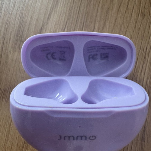 JMMO Bluetooth earbuds used with charging case