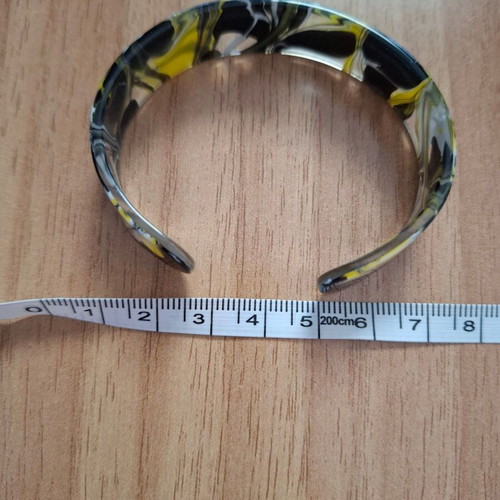 Plastic bracelet like bone colored like new