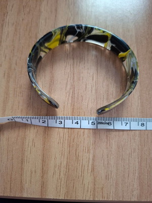 Plastic bracelet like bone colored like new