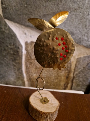 Decorative pomegranate like new on wooden base