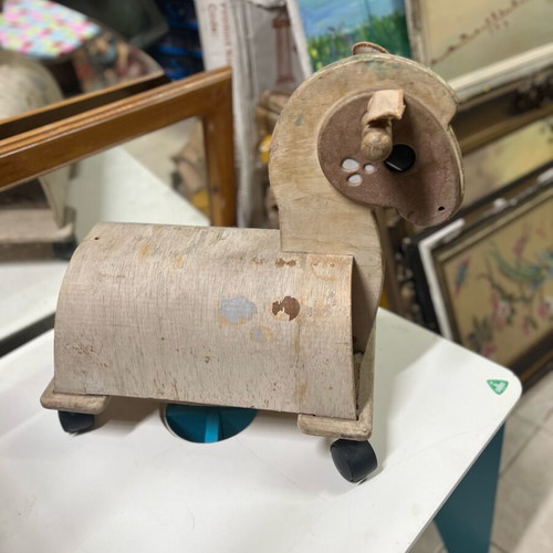 Wooden children's horse toy used with wear