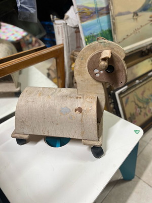 Wooden children's horse toy used with wear