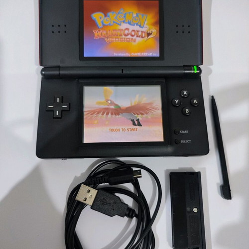 Nintendo DS Lite console used with Pokemon LeafGreen cartridge and accessories