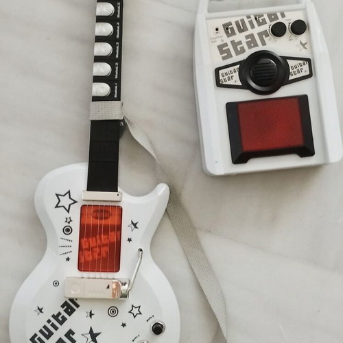 Electric guitar with amplifier toy used
