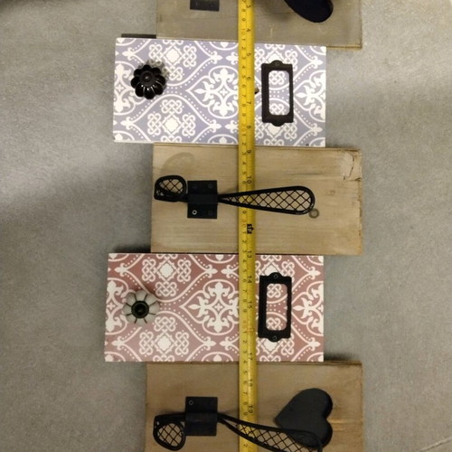 Decorative wall hanger used with wooden base and metal hooks