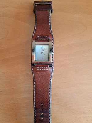 DKNY women's watch used with worn strap