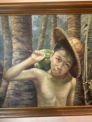 Painting of boy with coconut and hat