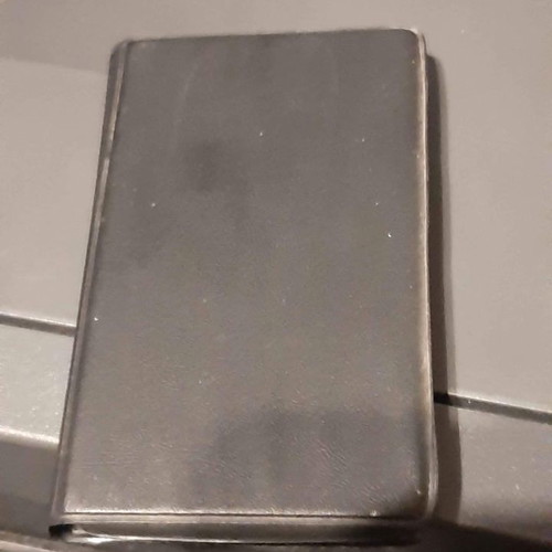 Philips pocket calculator used with vintage card holder