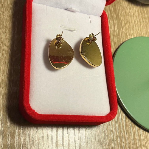 Vintage style earrings with deep red and gold trim