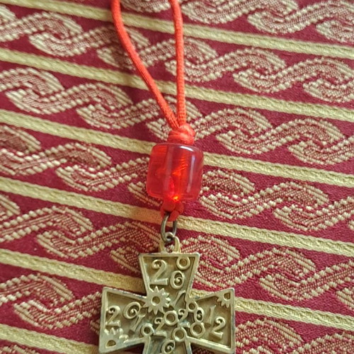 Collectible cross 2012 used with red bead decoration