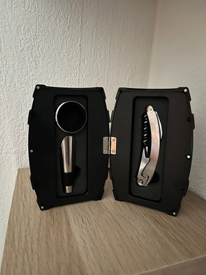 Wine set new with corkscrew, pourer, and serving ring