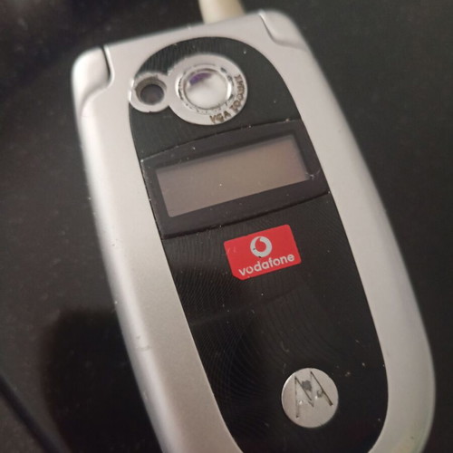 Motorola collectible cell phone like new, silver with flip cover