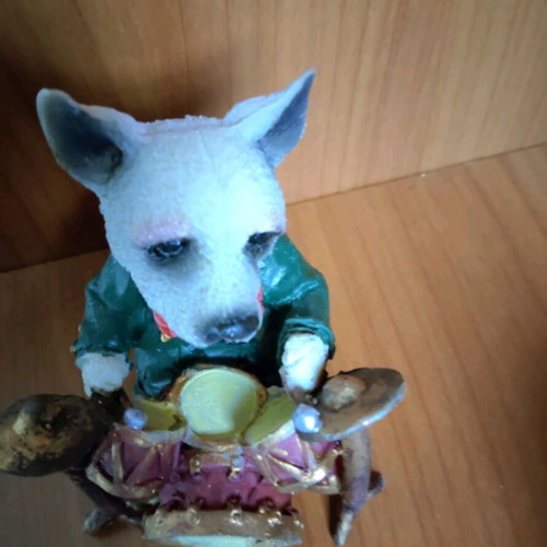 Decorative dog figure with drums like new