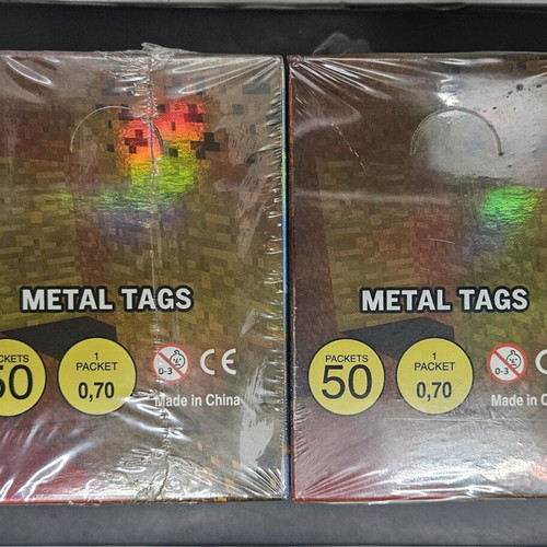 Minecraft Legends metal tags like new, 2 sealed boxes with 50 packs each