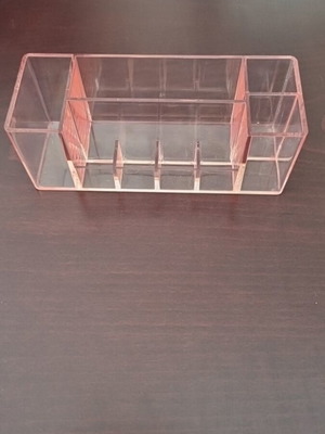 Acrylic small cosmetic organizer used, transparent pink