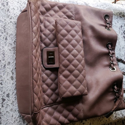 Backpack like new with quilted texture and handles