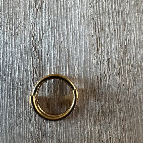 Gold septum piercing earring with sparkling stones
