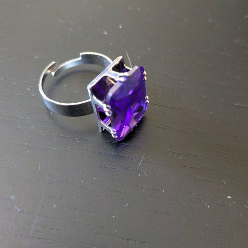 Steel ring like new with purple synthetic stone
