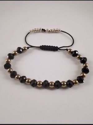 Handmade bracelet with black crystals and gold hematite beads, adjustable cord
