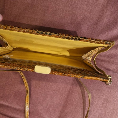 Crossbody bag used with python print leather pattern