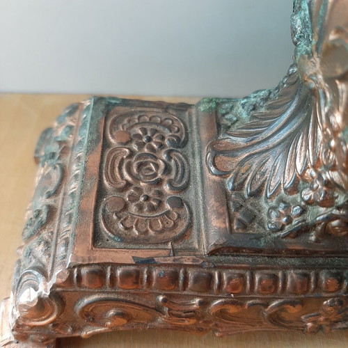 Copper German wind-up clock used with cathedral motif