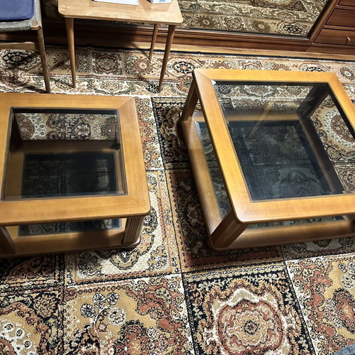 Set of two wooden square coffee tables with glass tops