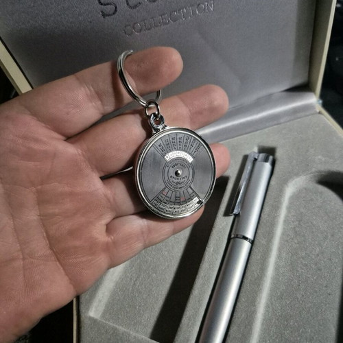 Vintage metal 50-year calendar keychain and metal pen like new
