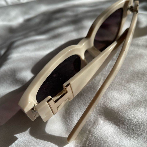 Sunglasses new, beige with metal decoration