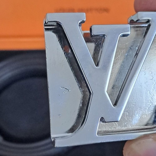 Louis Vuitton leather belt with interchangeable buckles