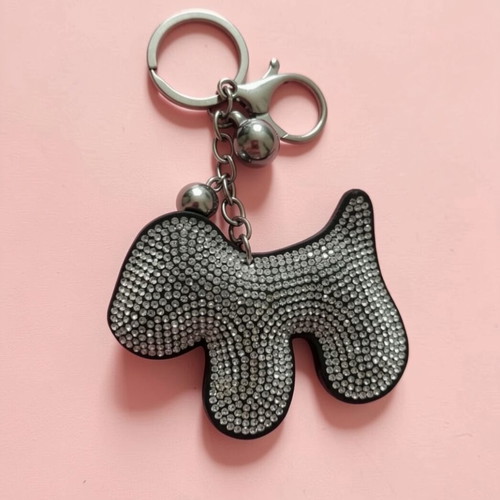 Dog-shaped keychain like new, black and silver