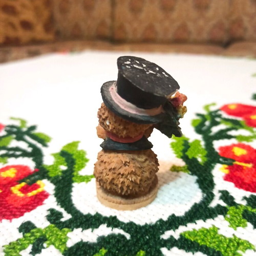 Hedgehog miniature figurine used, decorative with hat and flowers