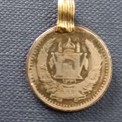 Pendant amulet made from Afghanistan coin used