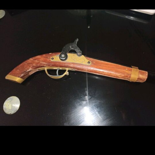 Decorative flintlock pistol used with vintage style