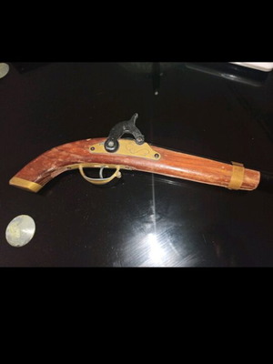Decorative flintlock pistol used with vintage style