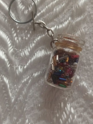Keychain in glass jar with colorful beads like new
