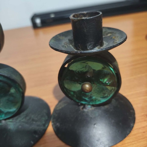 Old candle holders used, metal and glass