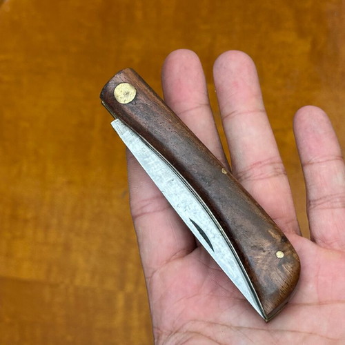 Vintage folding pocket knife with wooden handle, used, 10.7 cm