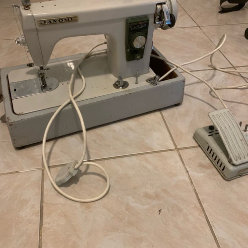 Electric collectible sewing machine used with carrying case