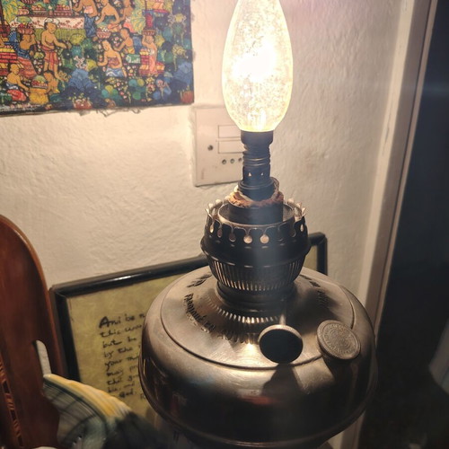 Lamp converted into adjustable light fixture