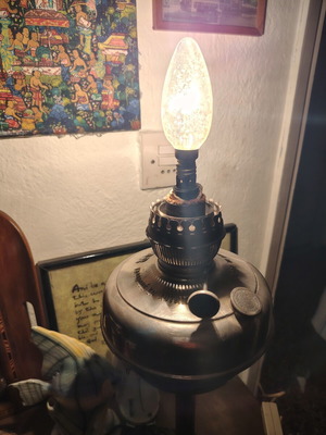 Lamp converted into adjustable light fixture