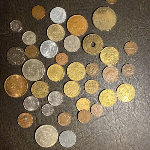 Collection of old metal coins and tokens from abroad