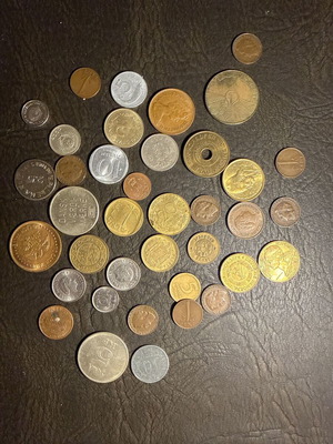 Collection of old metal coins and tokens from abroad