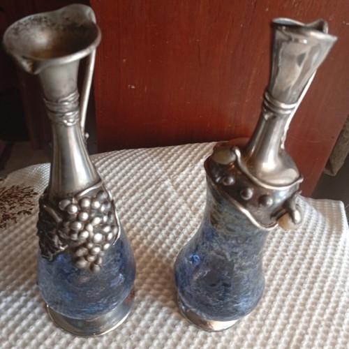 Vintage decorative silver pitchers with blue blown art glass