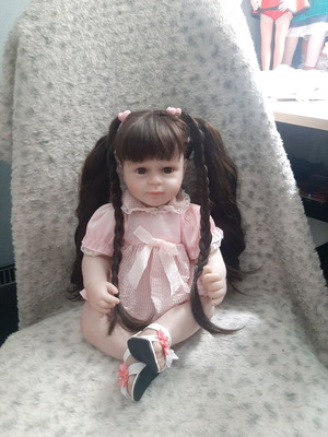 Reborn doll like new with cloth body