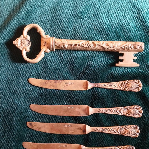 Set of used bronze knives and opener