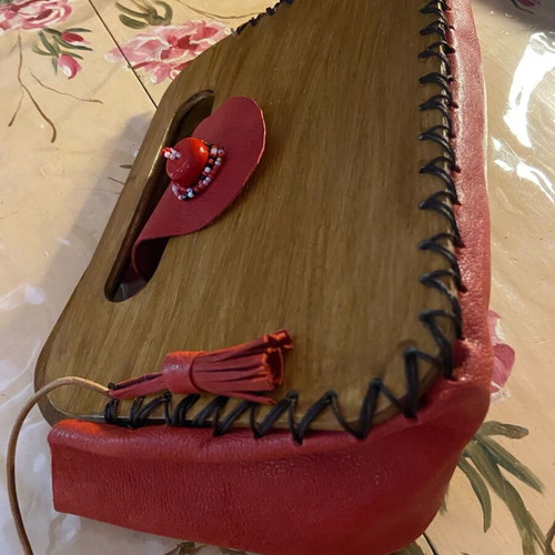 Wooden handmade bag with red leather stitched by hand