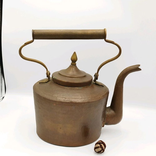 Vintage copper hand-forged teapot used with brass elements