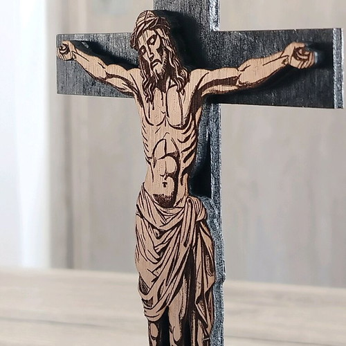 Handmade cross with embossed Jesus figure on laser cut wood